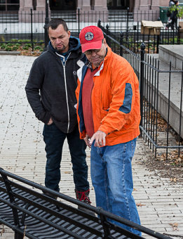 Founder Jeffrey Herkes discussing the Astor Place bench installation with a fellow metal fabricator.